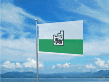 a flag that says hay on it is flying in the wind