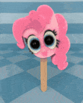 a pink ice cream cone with a cartoon character on it