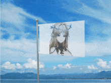 a flag with a picture of a girl on it is flying in the wind