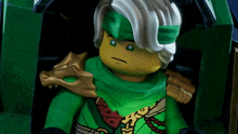 a close up of a lego figure with a green outfit
