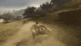 a man driving a car on a dirt road