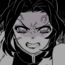a close up of a person 's face with a very angry look on their face .