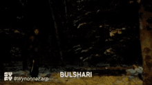 a woman is holding a gun in a dark forest and says bulshar