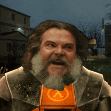 a man with a beard is wearing a half life emblem on his chest