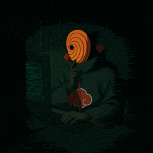 a person with a mask on their face is typing on a computer