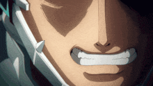 a close up of a man 's face with a smile