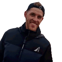 a man wearing a jacket that says nautica on it giving a peace sign