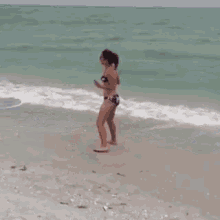 beach flexible girl handstand backflip