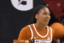 a female basketball player from south carolina is smiling