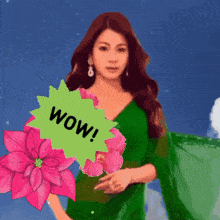 a woman in a green dress is holding a pink flower and a green wow sign