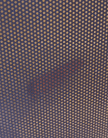 a close up of a blue and gold polka dot fabric