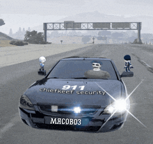 a 911 chiefkeef security car is driving down a road