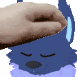 a pixelated image of a person 's hand touching a cartoon character 's face .