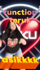 a woman is dancing in front of a red heart and the words function teruk ku