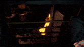 a fire is coming out of a barrel in a room