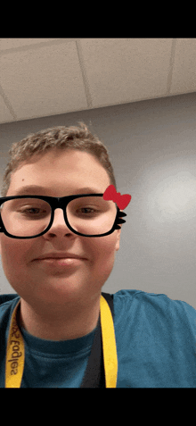 a young man wearing glasses and a lanyard that says dodge