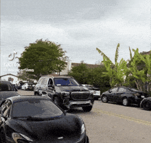 a row of cars are parked on the side of the road with a tiktok watermark