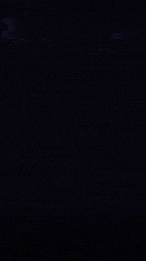 the number 5 is glowing in the dark with a reflection