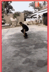 a man is doing a trick on a skateboard in front of a building