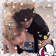 a girl is taking a picture of herself in a mirror while wearing a bear hat