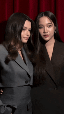a couple of women standing next to each other