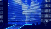 a cbs logo can be seen in the corner of the stage