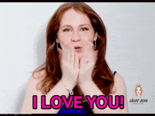 a woman blowing a kiss with the words " i love you " behind her