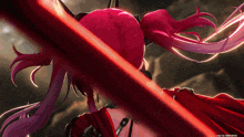 a girl with red hair is holding a red sword