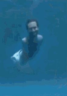 a painting of a person swimming under water