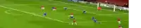 a soccer game is being played on a field that has a playstation banner