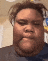 a close up of a person 's face with a very thick neck