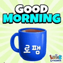 a blue coffee mug with the words good morning written above it