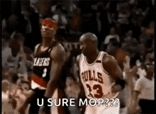 a couple of basketball players standing next to each other on a court with the words `` u sure mop ? ''