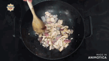a pan of food is being cooked on a stove and the words made in animotica are on the bottom of the pan