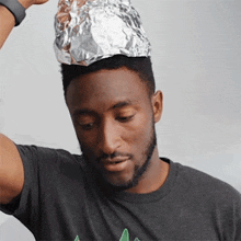 Putting On A Tin Foil Hat Marques Brownlee GIF - Putting On A Tin Foil Hat Marques Brownlee Protecting My Brain GIFs