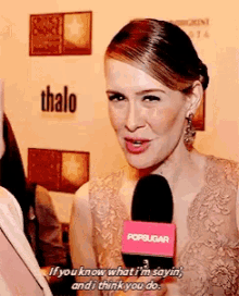 a woman is talking into a popsugar microphone and says " if you know what i 'm sayin "