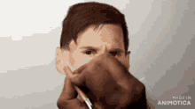 a person is drawing a picture of a man 's face .