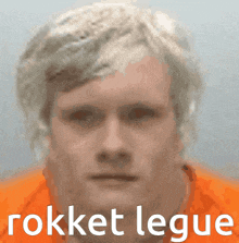 a close up of a man 's face with the words rokket legue on the bottom