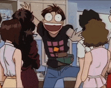 a group of people are standing around a man in a black shirt with squares on it
