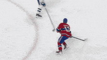 a hockey player with the number 71 on his jersey looks on