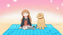 a girl sits on a blue blanket next to a dog with a red leash