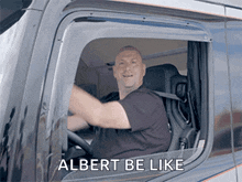 a man driving a truck with the words albert be like written on the window