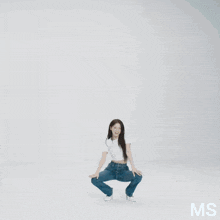 a woman is dancing in front of a warehouse with the number 30 on it