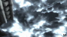 a dark cloudy sky with the letter m on the bottom right