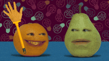 an orange and a pear with funny faces on them