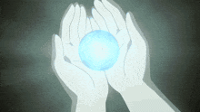 a pair of hands holding a blue sphere in their palms