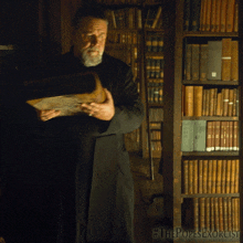 Carrying Book Father Gabriele Amorth GIF - Carrying Book Father Gabriele Amorth Russell Crowe GIFs