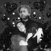 a black and white photo of a man and a woman with hearts around them and the words picmix on the bottom