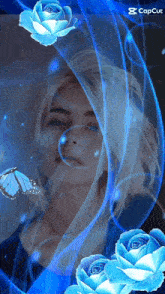 a woman is surrounded by blue roses and butterflies with the caption capcut at the bottom