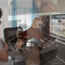a blurry picture of a man playing a video game on a computer